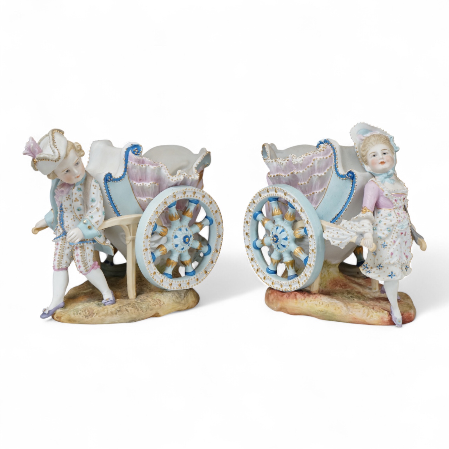 A pair of French coloured biscuit porcelain carriage group centre pieces, 21cm wide
